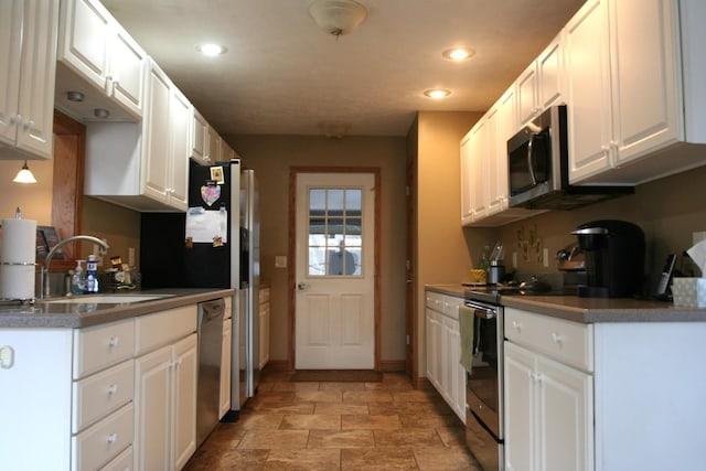 kitchen with sink, white cabinetry, and appliances with stainless steel finishes