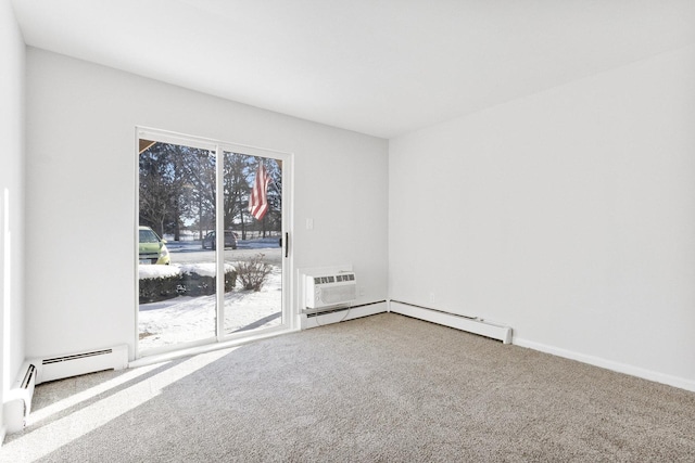 carpeted empty room featuring a baseboard heating unit and an AC wall unit