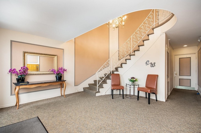 interior space featuring a notable chandelier and carpet flooring