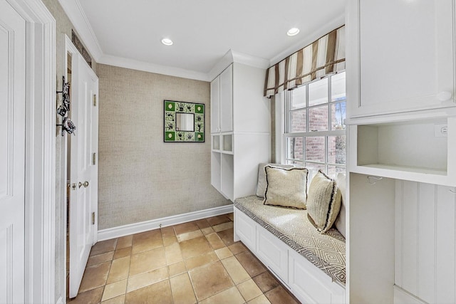 sitting room with crown molding and light tile patterned flooring