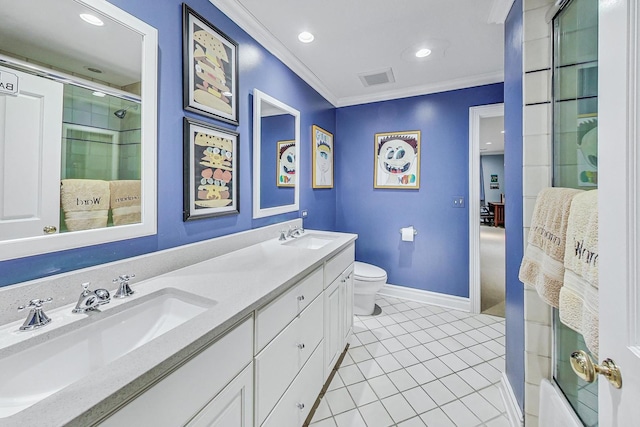 bathroom with toilet, vanity, ornamental molding, and tile patterned flooring