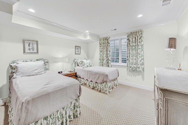 bedroom featuring crown molding and light carpet