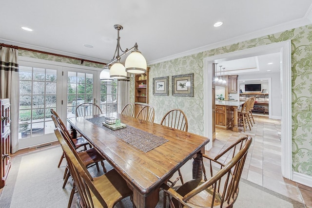 tiled dining space with french doors and crown molding