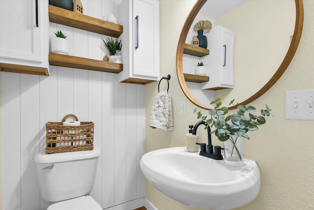 bathroom with sink and toilet