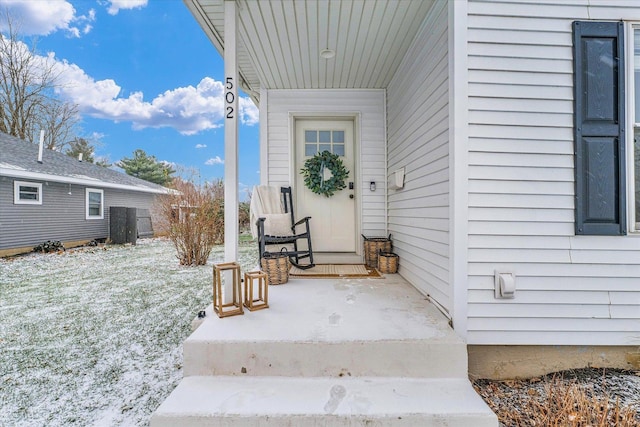 view of snow covered property entrance