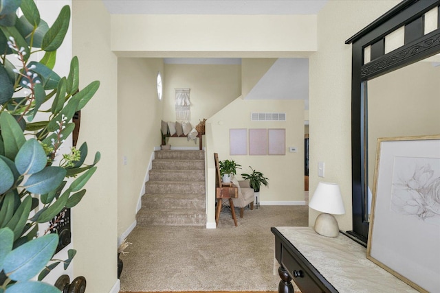 entrance foyer with light carpet