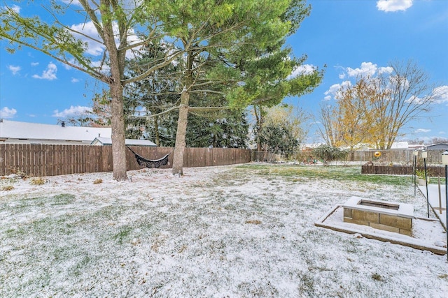 view of yard layered in snow