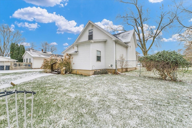 snow covered property with a lawn