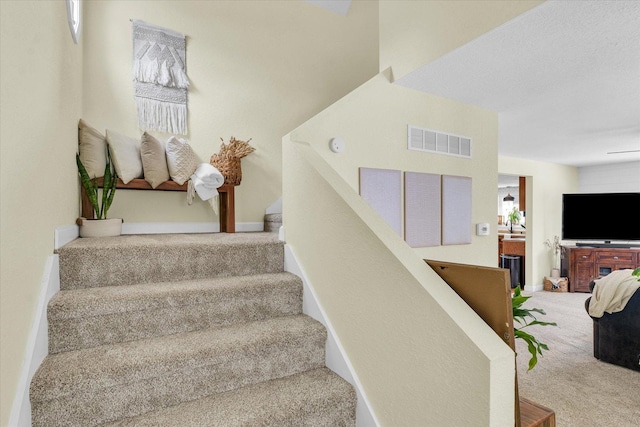 staircase with carpet flooring