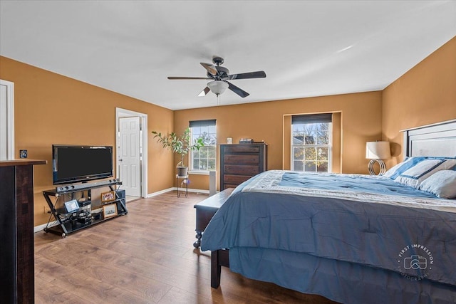 bedroom with hardwood / wood-style flooring and ceiling fan