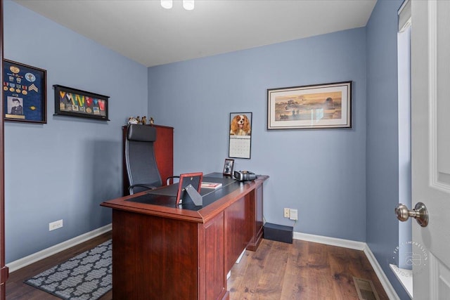 office space with dark hardwood / wood-style flooring