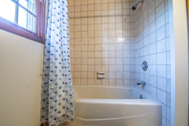 bathroom featuring shower / bath combination with curtain