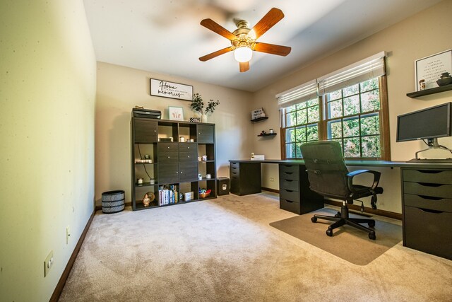 carpeted home office with ceiling fan