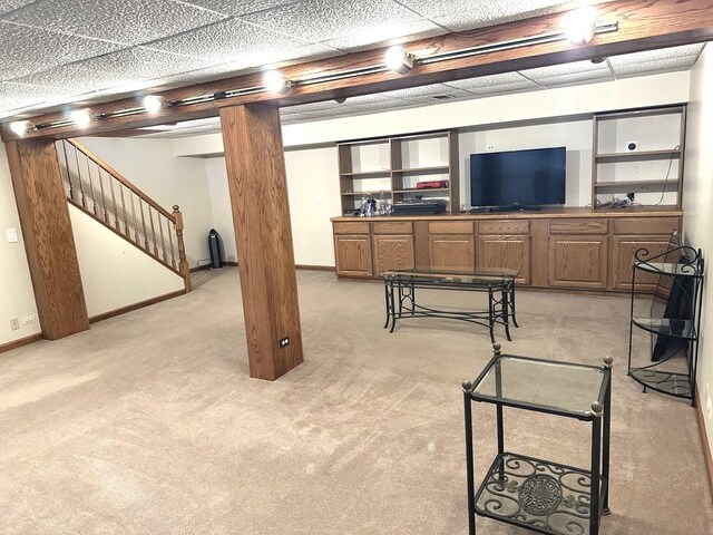 basement featuring light carpet