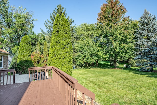 wooden terrace with a yard