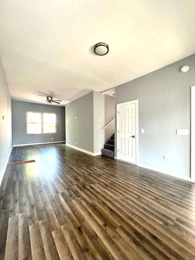 unfurnished room featuring ceiling fan and dark hardwood / wood-style floors