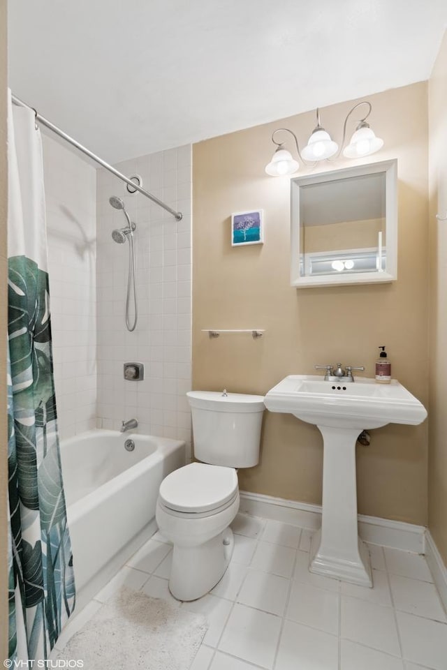 full bathroom featuring shower / tub combo with curtain, sink, tile patterned floors, and toilet