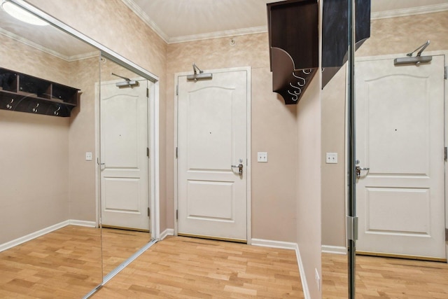 doorway to outside featuring light hardwood / wood-style floors and crown molding