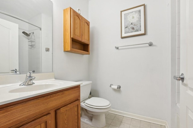 bathroom featuring a shower, toilet, and vanity