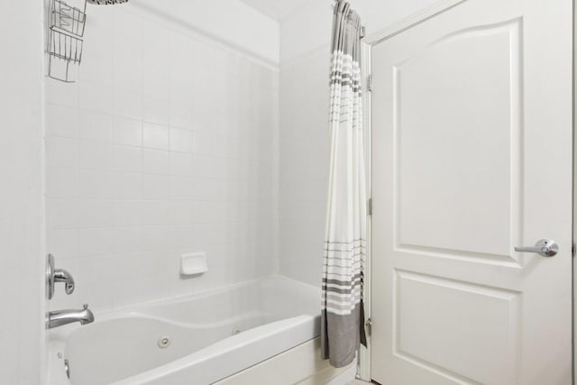 bathroom with shower / bath combination with curtain