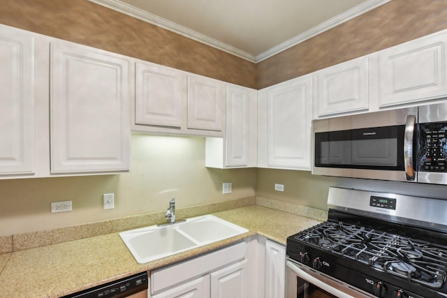 kitchen with sink, white cabinetry, appliances with stainless steel finishes, and ornamental molding