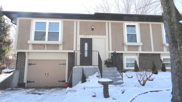 split foyer home featuring a garage