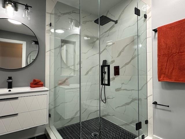 bathroom with vanity and walk in shower