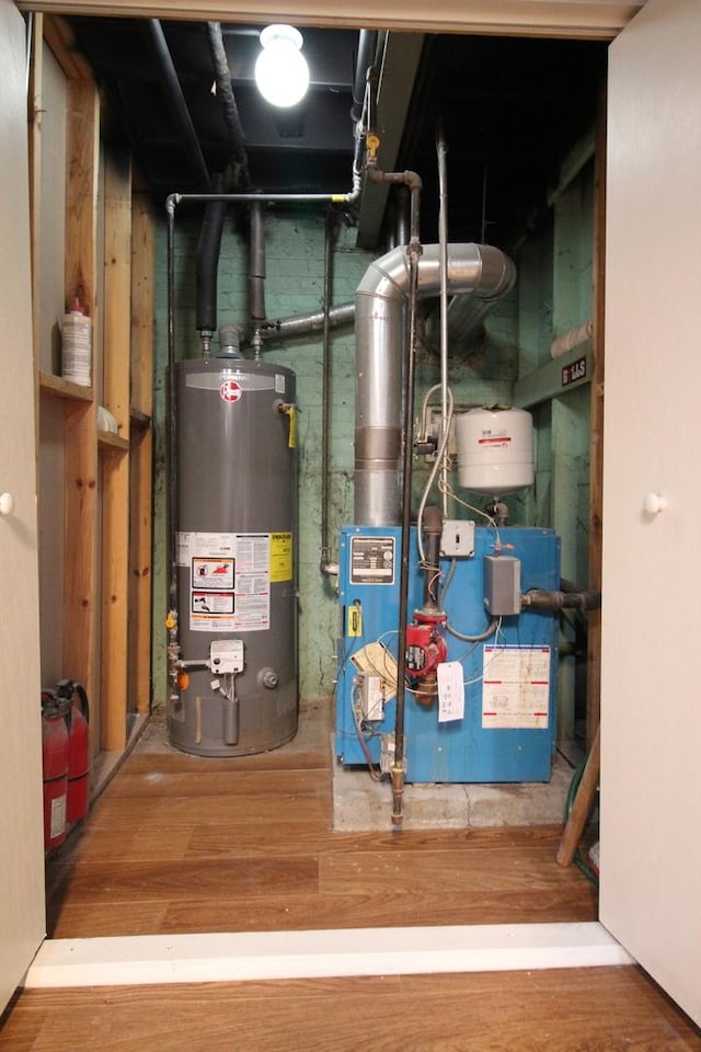 utility room featuring water heater