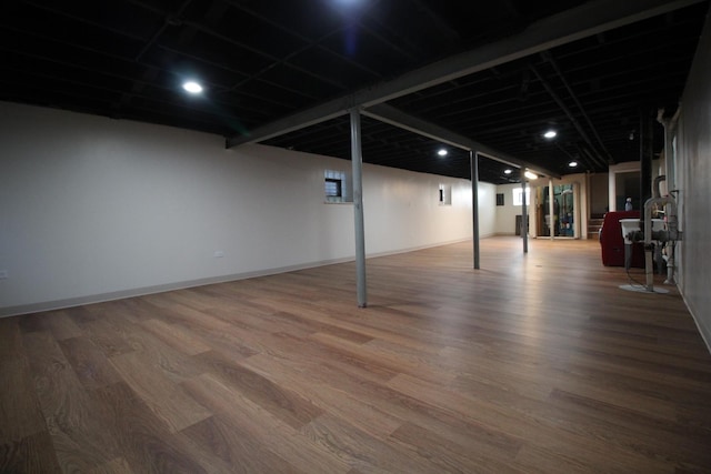 basement featuring hardwood / wood-style floors