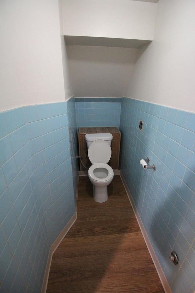 bathroom featuring toilet, tile walls, and hardwood / wood-style floors