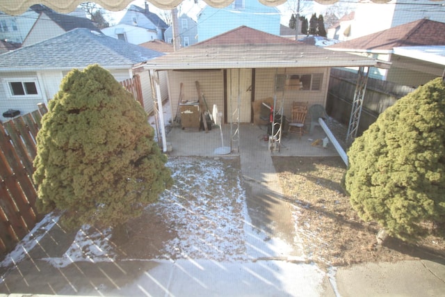 rear view of house with an outbuilding