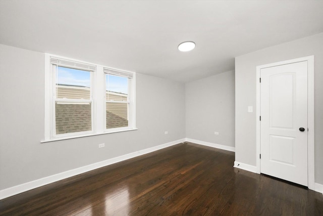 unfurnished room featuring dark hardwood / wood-style floors