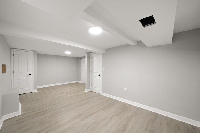 basement featuring light hardwood / wood-style flooring