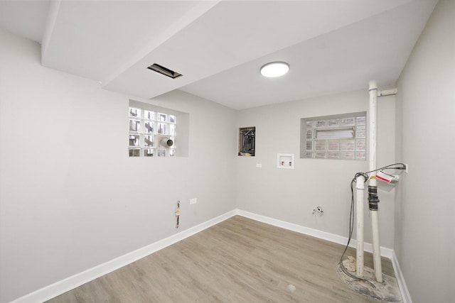 laundry area with hardwood / wood-style floors and hookup for a washing machine