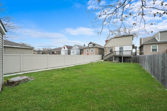 view of yard with a wooden deck