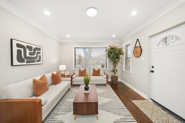 living room with dark hardwood / wood-style flooring and crown molding