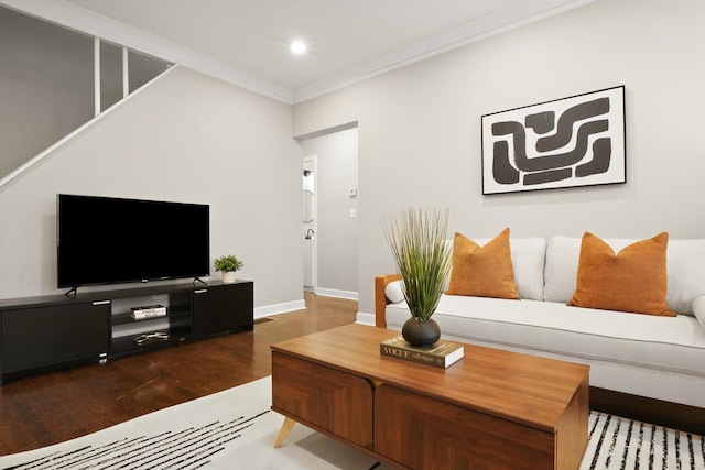 living room with hardwood / wood-style flooring and ornamental molding