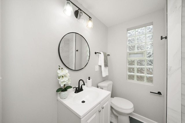 bathroom featuring toilet and vanity