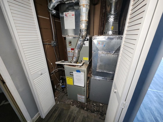 utility room featuring heating unit