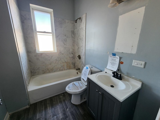 full bathroom featuring a healthy amount of sunlight, shower / bath combination, toilet, and hardwood / wood-style flooring