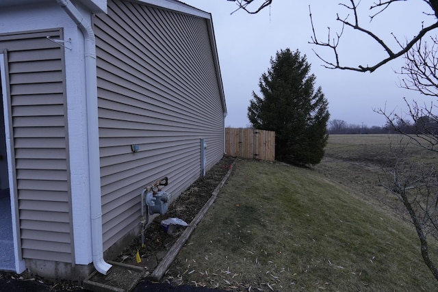 view of side of property with a yard