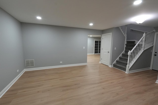 spare room featuring light hardwood / wood-style floors