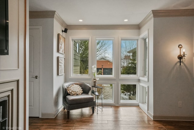 sitting room featuring crown molding and dark hardwood / wood-style floors