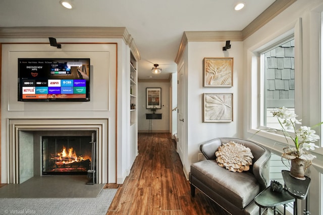 hall with crown molding, dark wood-type flooring, and built in shelves