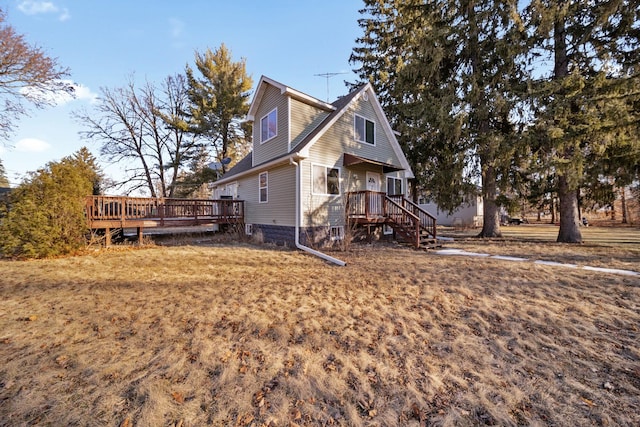 view of home's exterior with a wooden deck