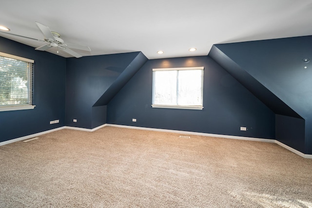 bonus room with ceiling fan, vaulted ceiling, and carpet floors