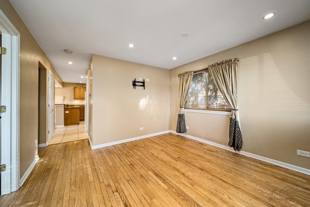 unfurnished room featuring light hardwood / wood-style floors