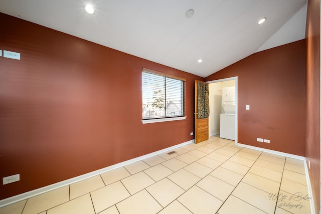 empty room with lofted ceiling