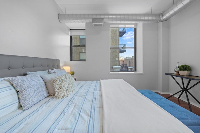 bedroom featuring hardwood / wood-style floors