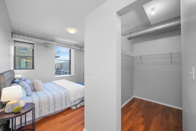 bedroom with wood-type flooring